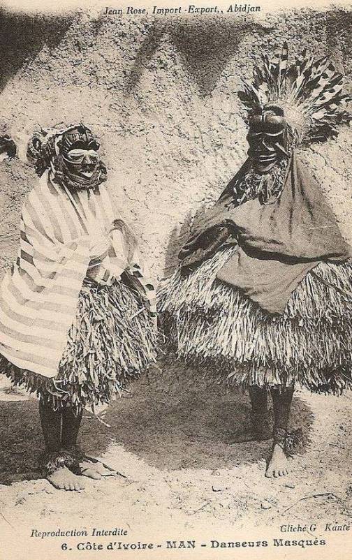 Masked dancer, western Ivory Coast, circa 1910. Dan or Guere ethnic group. Vintage postcard photographer G. Kante.