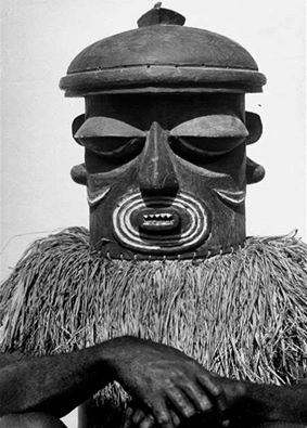 A Bayaka man wearing a mask for a ritual in the Belgian Congo. 1947. Photograph by Eliot Elisofon.
