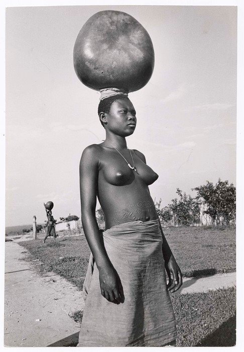 A Bembe woman carrying water in the Congo 1951, by Eliot Elisofon.